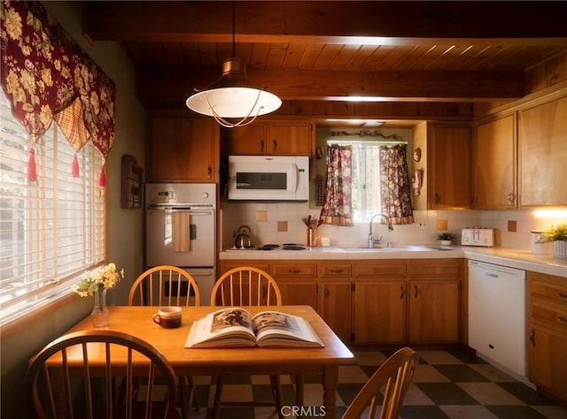 278 Mittry Ln, Lake Arrowhead, CA 92352 - kitchen with white appliances, dark flooring, beamed ceiling, tile counters, and tasteful backsplash