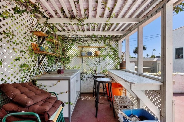 view of patio with outdoor dry bar and a pergola