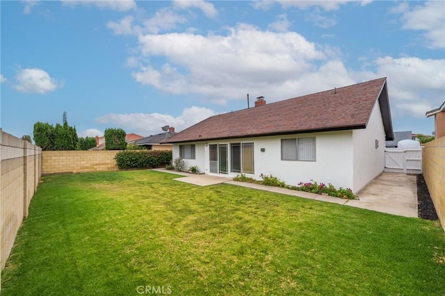 21122 Amberwick Ln, Huntington Beach, CA 92646 - rear view of property with a patio, stucco siding, a lawn, a shingled roof, and a fenced backyard