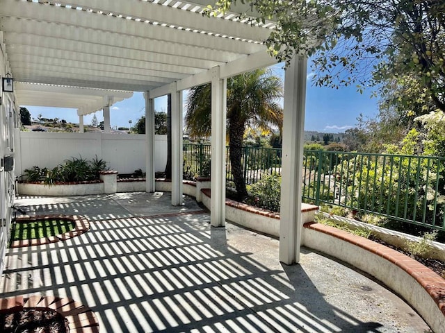 view of patio / terrace with fence and a pergola