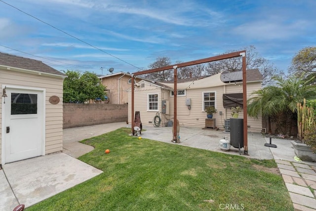 exterior space with a patio and a fenced backyard