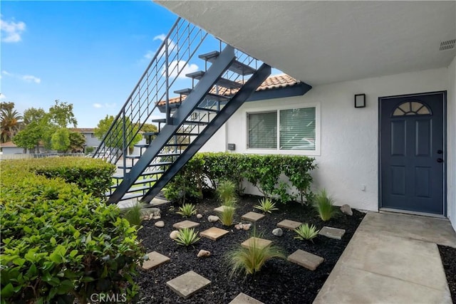 615 Calle Campana, San Clemente, CA 92673 - entrance to property featuring visible vents, stucco siding, and a tile roof