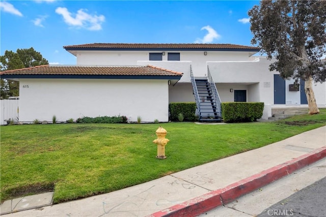 615 Calle Campana, San Clemente, CA 92673 - view of front facade featuring a tile roof, stairs, a front yard, and stucco siding