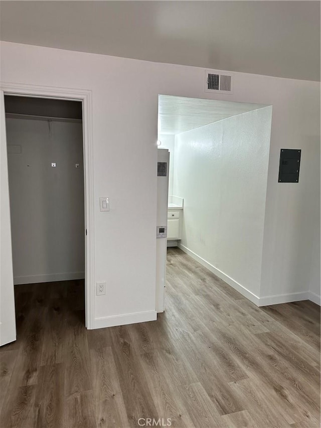 615 Calle Campana, San Clemente, CA 92673 - unfurnished room featuring baseboards, electric panel, wood finished floors, and visible vents