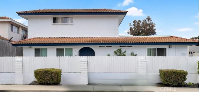 615 Calle Campana, San Clemente, CA 92673 - rear view of house with a tiled roof, fence private yard, and stucco siding