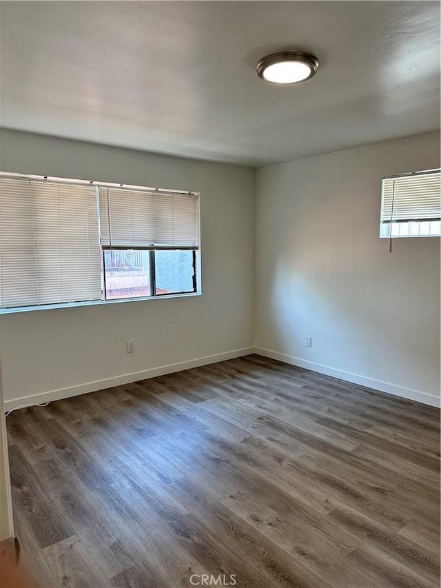 615 Calle Campana, San Clemente, CA 92673 - spare room featuring baseboards and wood finished floors