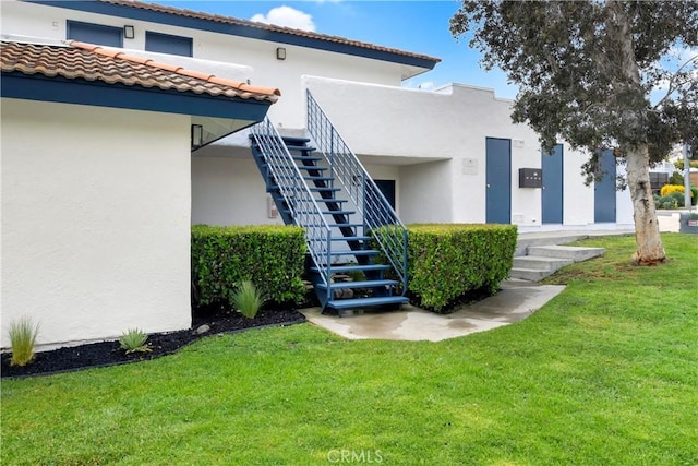 615 Calle Campana, San Clemente, CA 92673 - exterior space featuring stucco siding, a yard, and a tiled roof