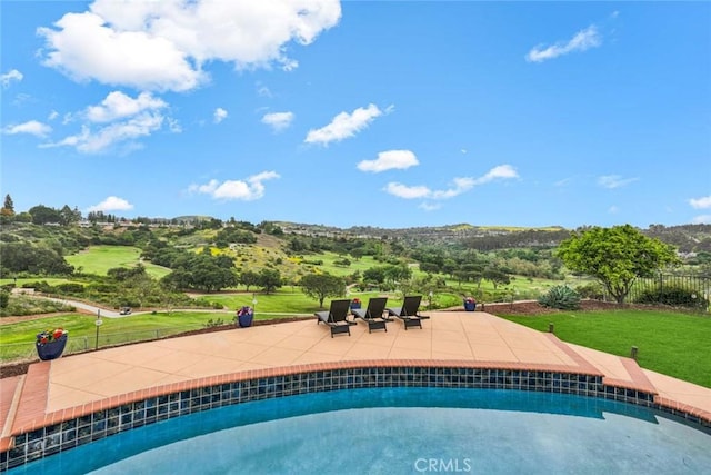 6586 E Via Corral, Anaheim Hills, CA 92807 - outdoor pool with fence, a patio, and a yard