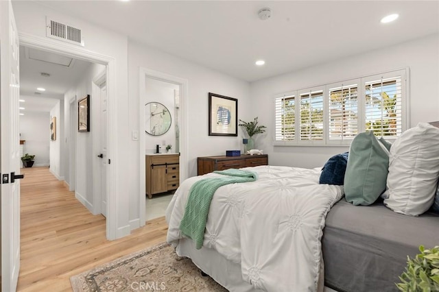 bedroom featuring recessed lighting, visible vents, and light wood-style floors