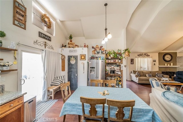 7120 Lyons Ave, Hesperia, CA 92345 - dining space featuring vaulted ceiling and dark wood finished floors