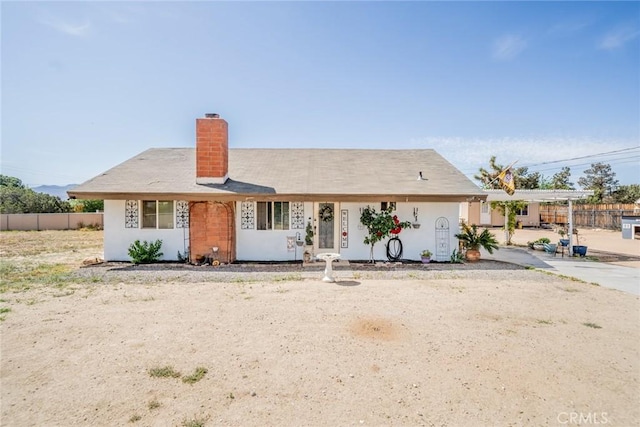 7120 Lyons Ave, Hesperia, CA 92345 - ranch-style house with fence and a chimney