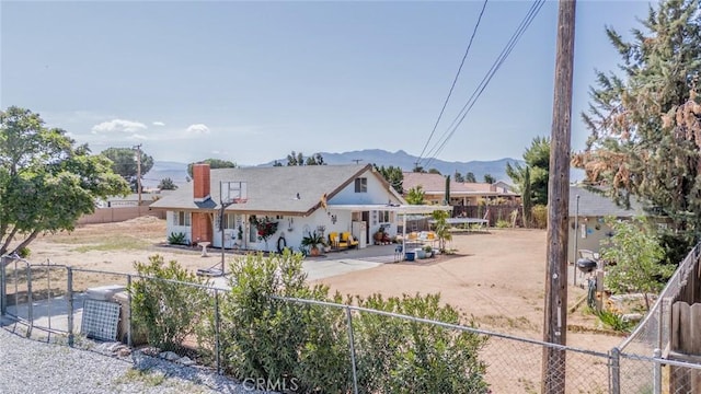 7120 Lyons Ave, Hesperia, CA 92345 - rear view of property with fence private yard and a mountain view