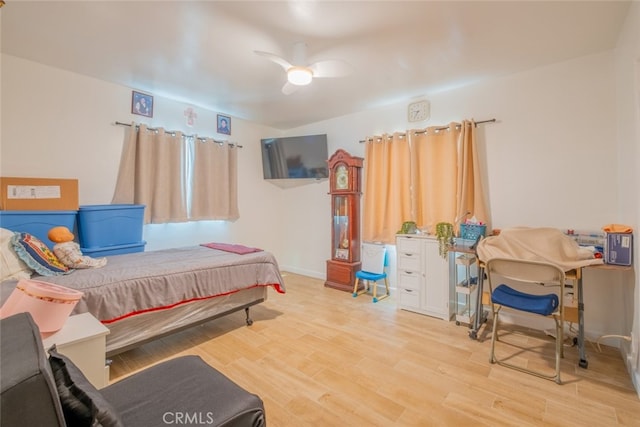 bedroom featuring ceiling fan and wood finished floors