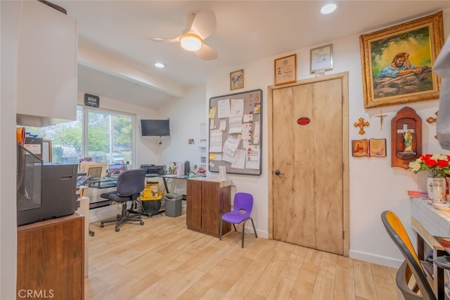 office space featuring baseboards, light wood-type flooring, recessed lighting, a ceiling fan, and vaulted ceiling