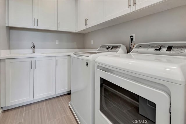 137 Lavender, Lake Forest, CA 92630 - laundry room featuring a sink, cabinet space, and washer and clothes dryer