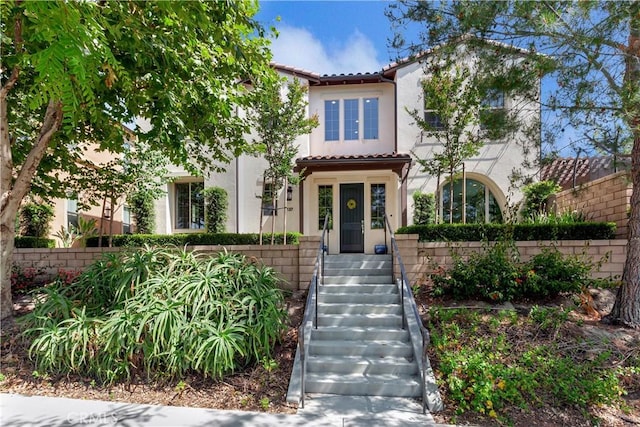 137 Lavender, Lake Forest, CA 92630 - mediterranean / spanish house featuring stairs, stucco siding, and a tiled roof
