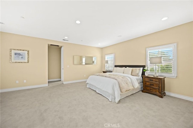 bedroom featuring baseboards, light carpet, and recessed lighting