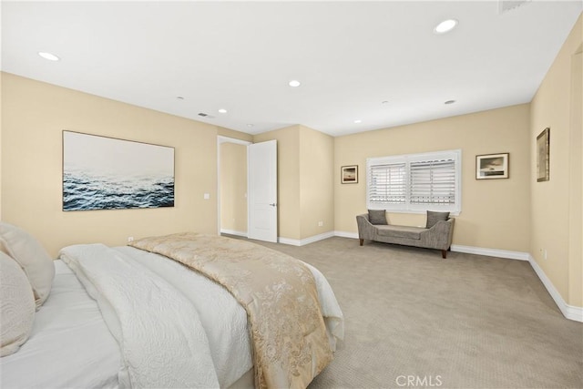 bedroom featuring baseboards, light carpet, and recessed lighting