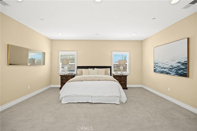 bedroom featuring recessed lighting, baseboards, visible vents, and light carpet