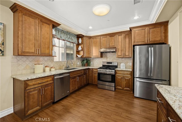 kitchen with open shelves, dark wood-style flooring, under cabinet range hood, a sink, and appliances with stainless steel finishes