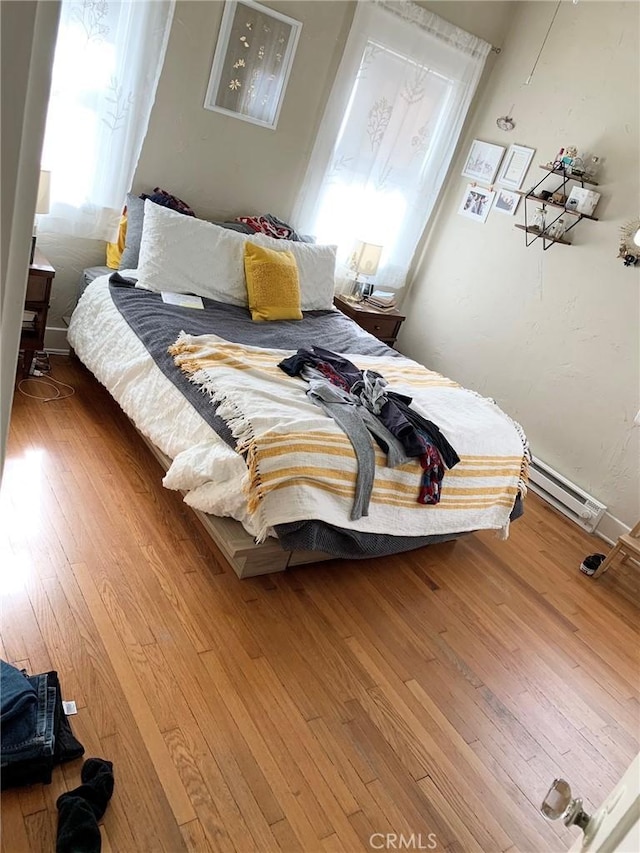 1116 E Appleton St, Long Beach, CA 90802 - bedroom with a baseboard radiator and hardwood / wood-style floors