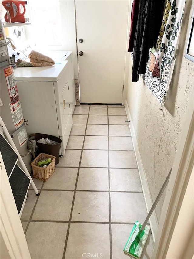 1116 E Appleton St, Long Beach, CA 90802 - laundry room with light tile patterned floors, gas water heater, laundry area, and washer and dryer