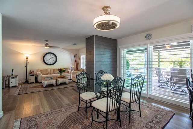 dining area featuring a ceiling fan and wood finished floors