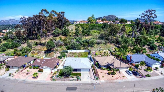 birds eye view of property with a residential view and a mountain view