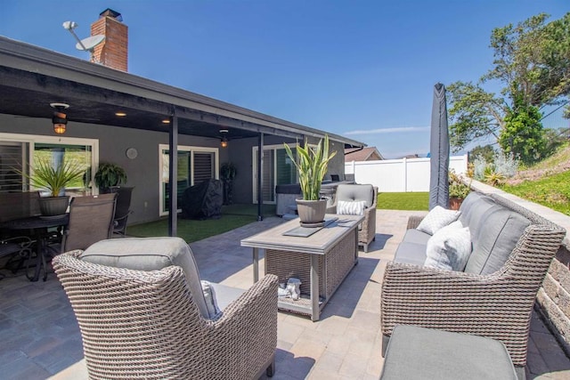 view of patio / terrace with fence and outdoor lounge area