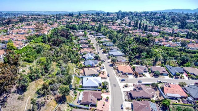birds eye view of property with a residential view and a mountain view