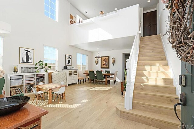 3524 Lone Pine Ln, San Marcos, CA 92078 - living room featuring recessed lighting, light wood finished floors, stairway, and a towering ceiling
