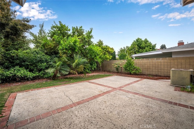 view of patio featuring fence