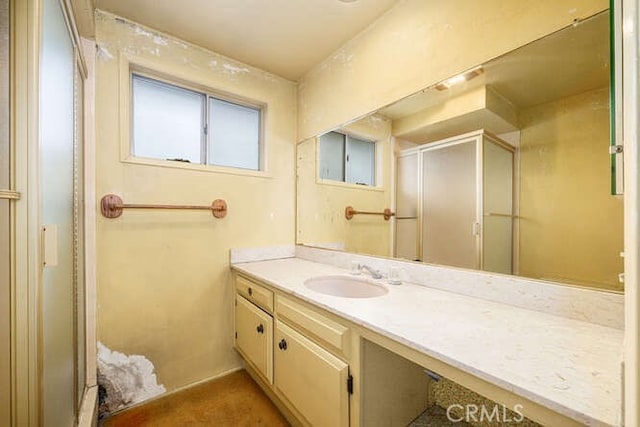 bathroom featuring vanity and a stall shower
