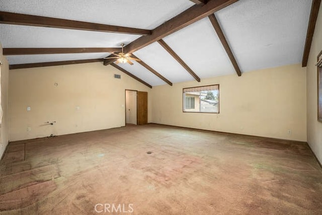 interior space with a ceiling fan, light colored carpet, and lofted ceiling with beams