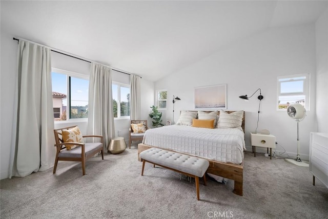 carpeted bedroom with high vaulted ceiling, multiple windows, and baseboards
