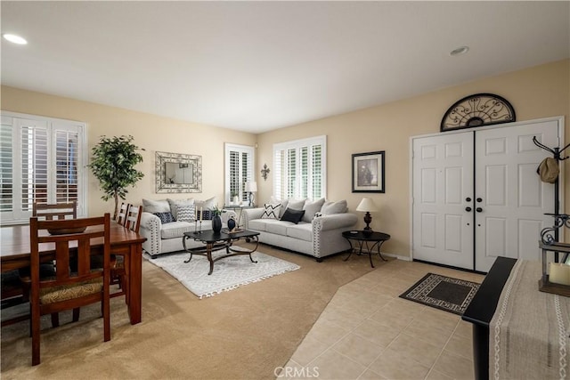 living room featuring recessed lighting and light colored carpet