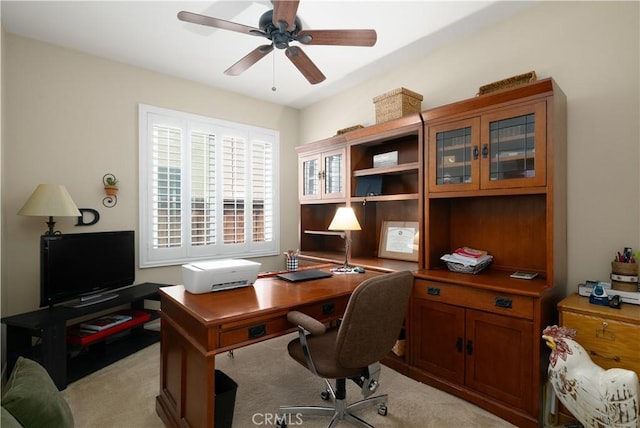office space featuring light colored carpet and a ceiling fan