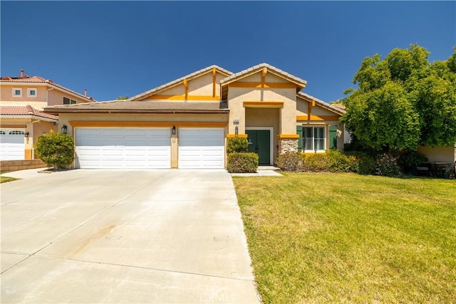 craftsman-style home with a garage, stucco siding, driveway, and a front yard