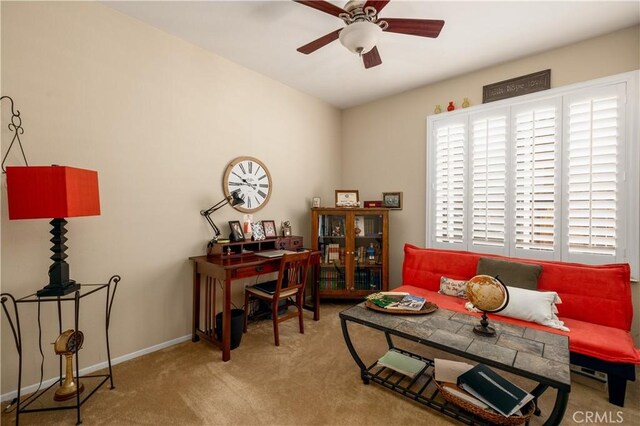 home office featuring ceiling fan, baseboards, and carpet