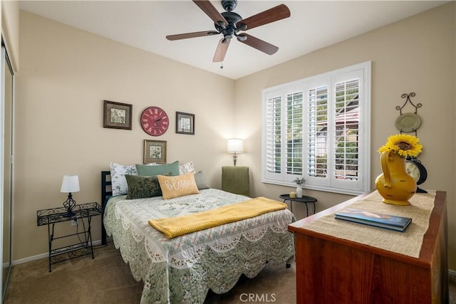 bedroom with carpet flooring, a ceiling fan, and baseboards