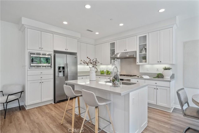 125 Annuals, Irvine, CA 92618 - kitchen with a sink, white cabinetry, under cabinet range hood, and stainless steel appliances