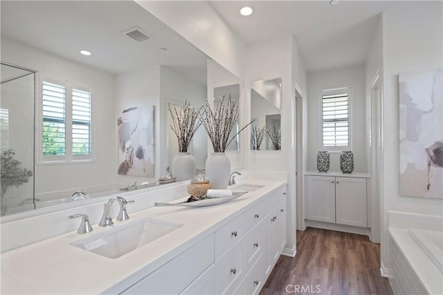 125 Annuals, Irvine, CA 92618 - full bath with a sink, wood finished floors, a bath, and visible vents