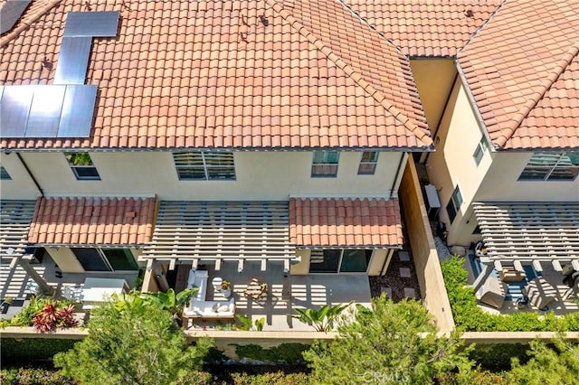 125 Annuals, Irvine, CA 92618 - rear view of house with a tile roof and stucco siding