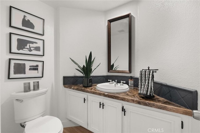 101 Fairlane Rd, Laguna Niguel, CA 92677 - half bathroom with toilet, tasteful backsplash, and vanity