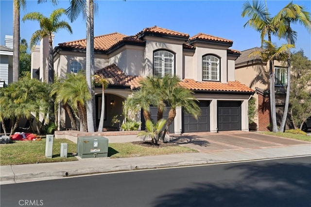 101 Fairlane Rd, Laguna Niguel, CA 92677 - mediterranean / spanish house with a garage, stucco siding, concrete driveway, and a tile roof