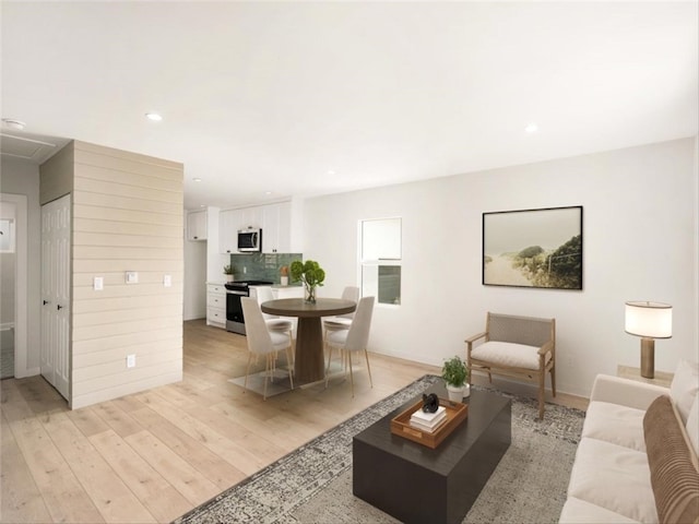 living room featuring recessed lighting and light wood-style floors