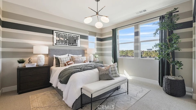 bedroom featuring baseboards, light carpet, and visible vents