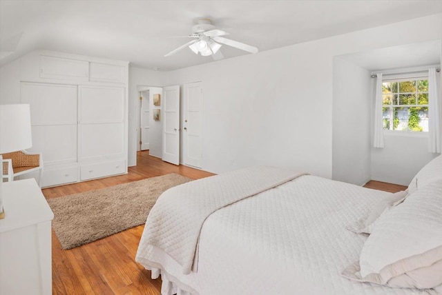 bedroom featuring light wood-style floors and a ceiling fan