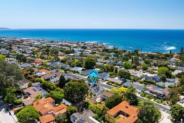 birds eye view of property with a water view and a residential view