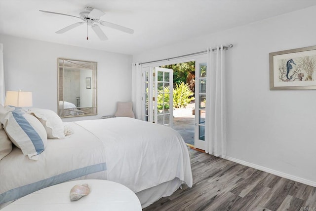 bedroom with baseboards, a ceiling fan, wood finished floors, and access to exterior